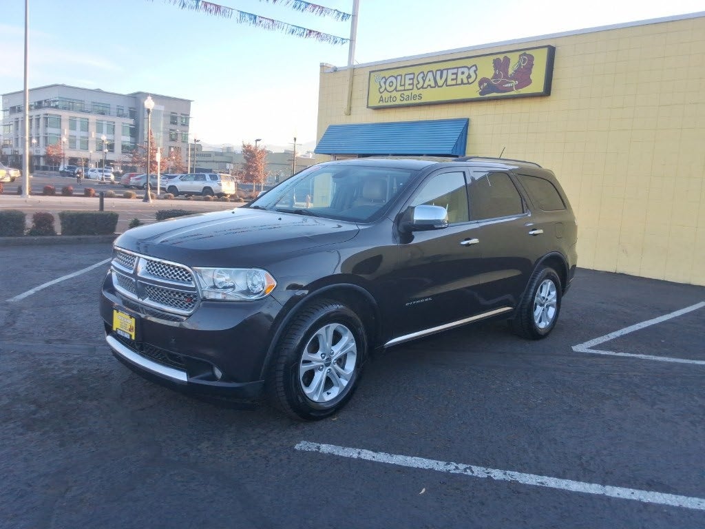 Black SUV in the Sole Savers Medford dealership lot
